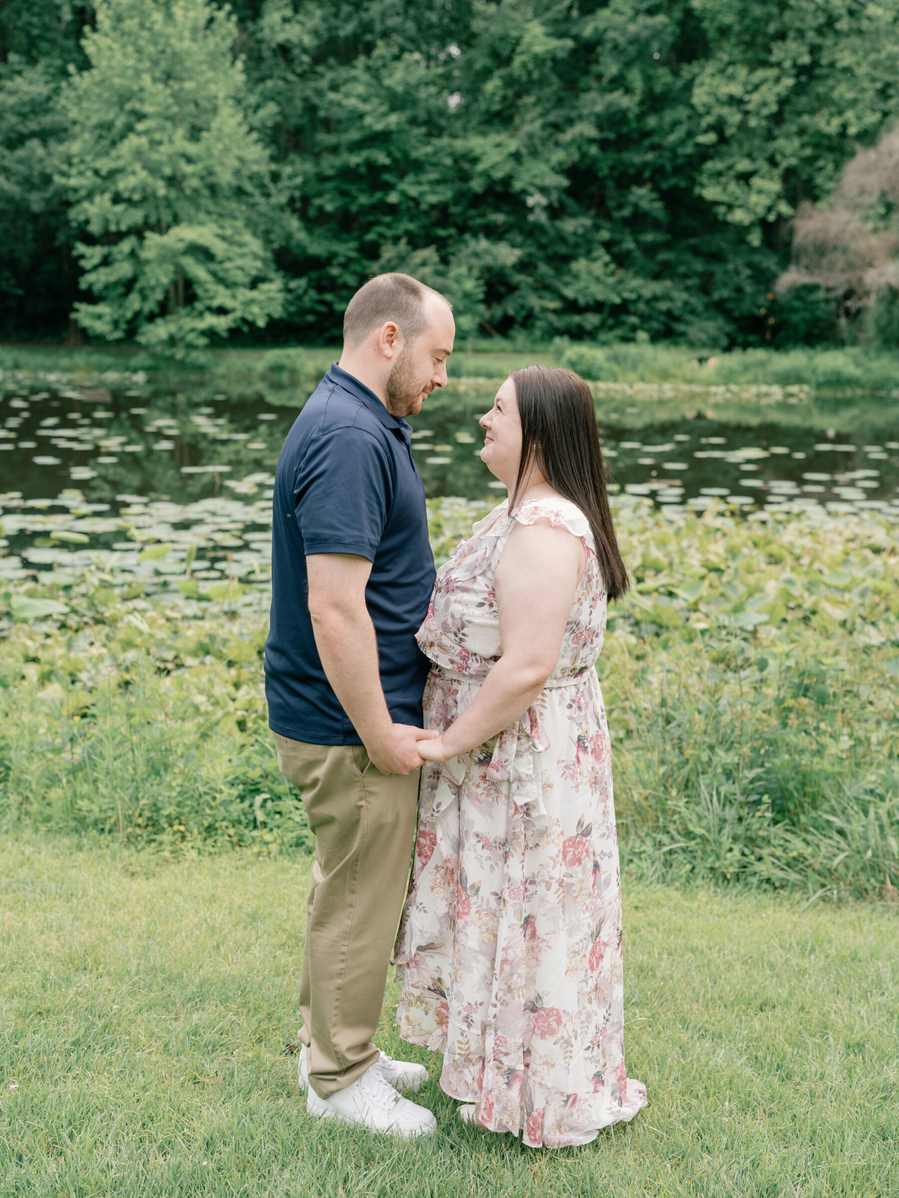 Meadowlark Botanical Gardens Engagement Session | couple holding hands in front of a pond at Meadowlark Botanical Gardens in Northern VA