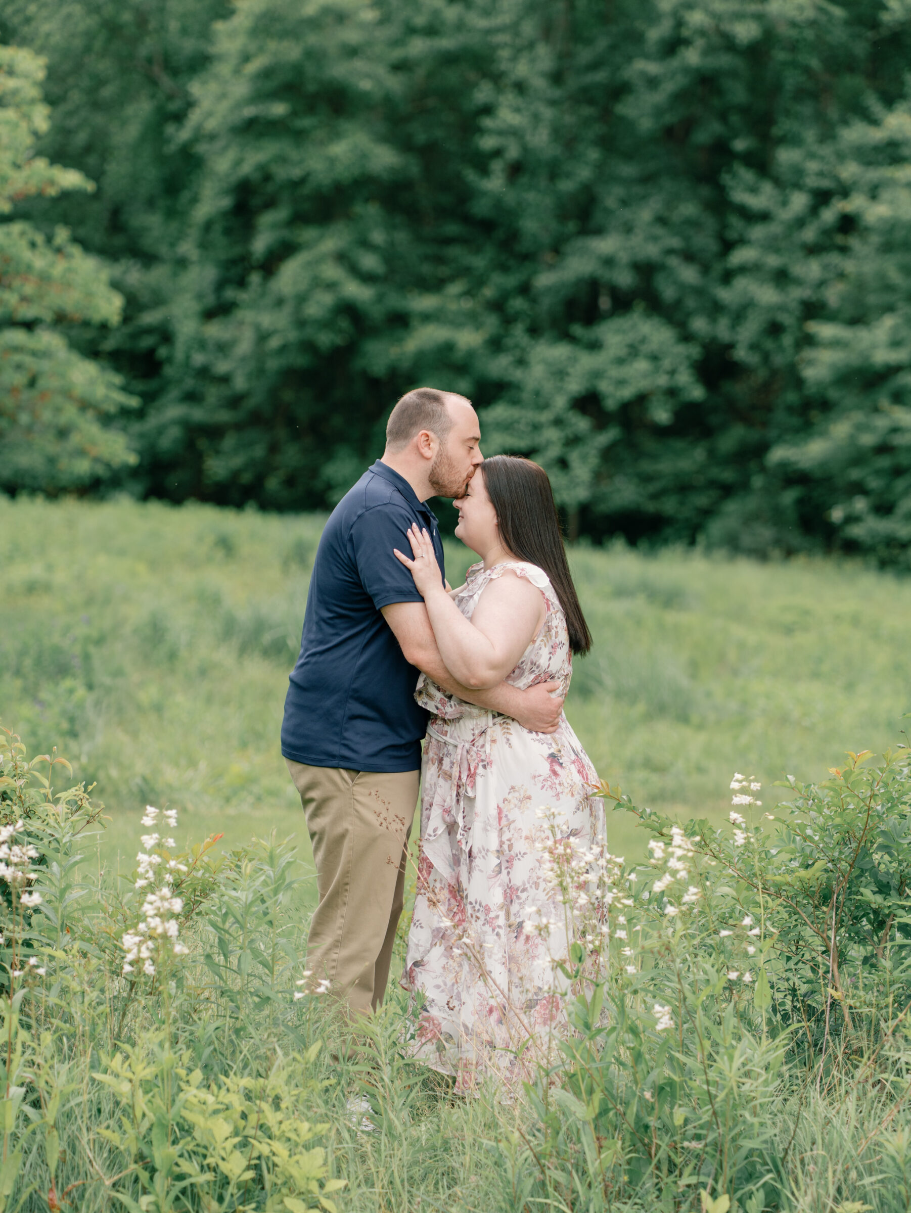 Meadowlark Botanical Gardens Engagement Photos | groom kisses bride on the forehead, captured by a Northern Virginia Wedding Photographer
