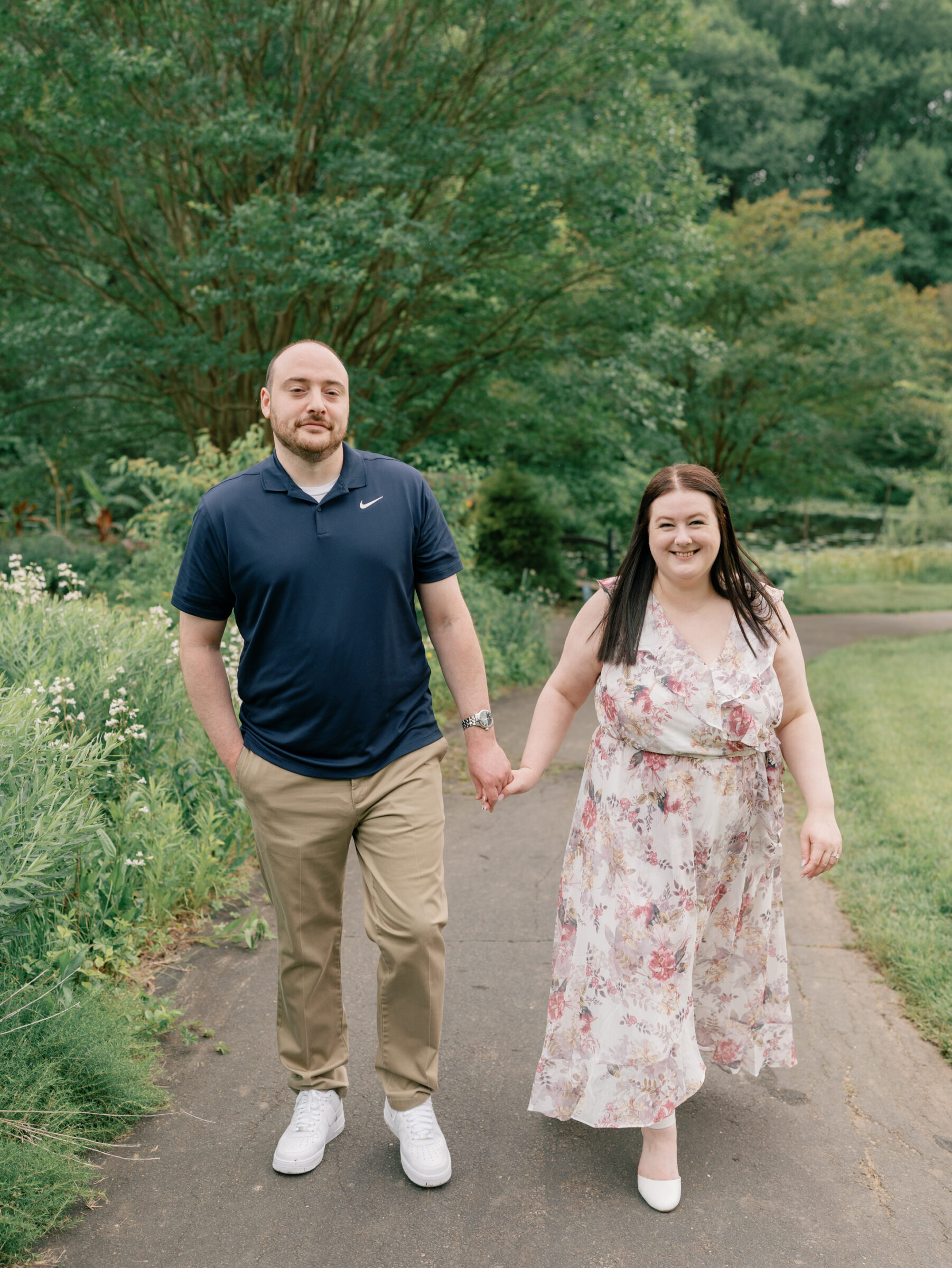 Meadowlark Botanical Gardens Engagement Photos | couple walk hand in hand at Meadowlark Botanical Gardens, captured by a Northern Virginia Wedding Photographer