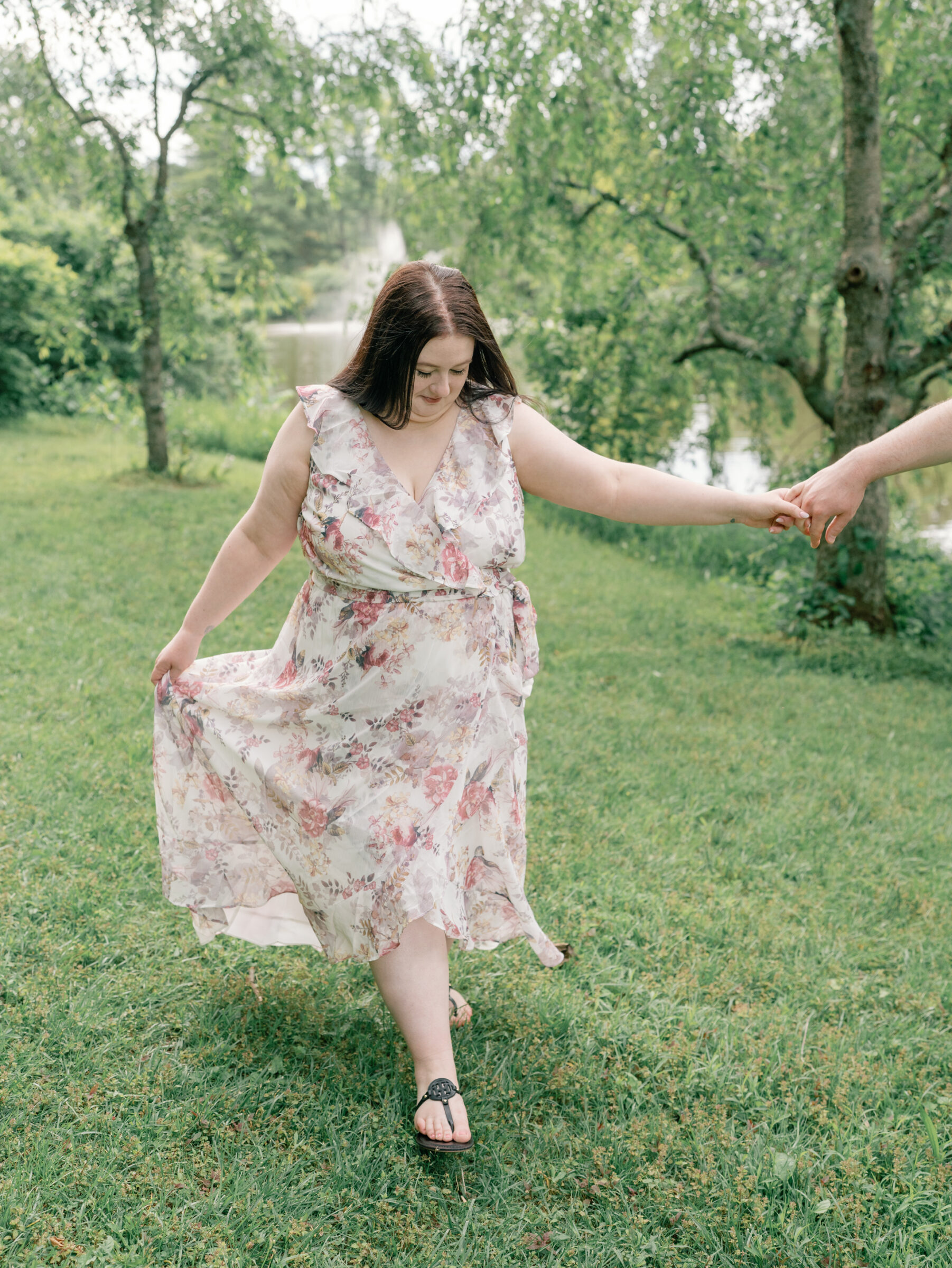 Meadowlark Botanical Gardens Engagement Photos | bride holds her groom's hand as they walk