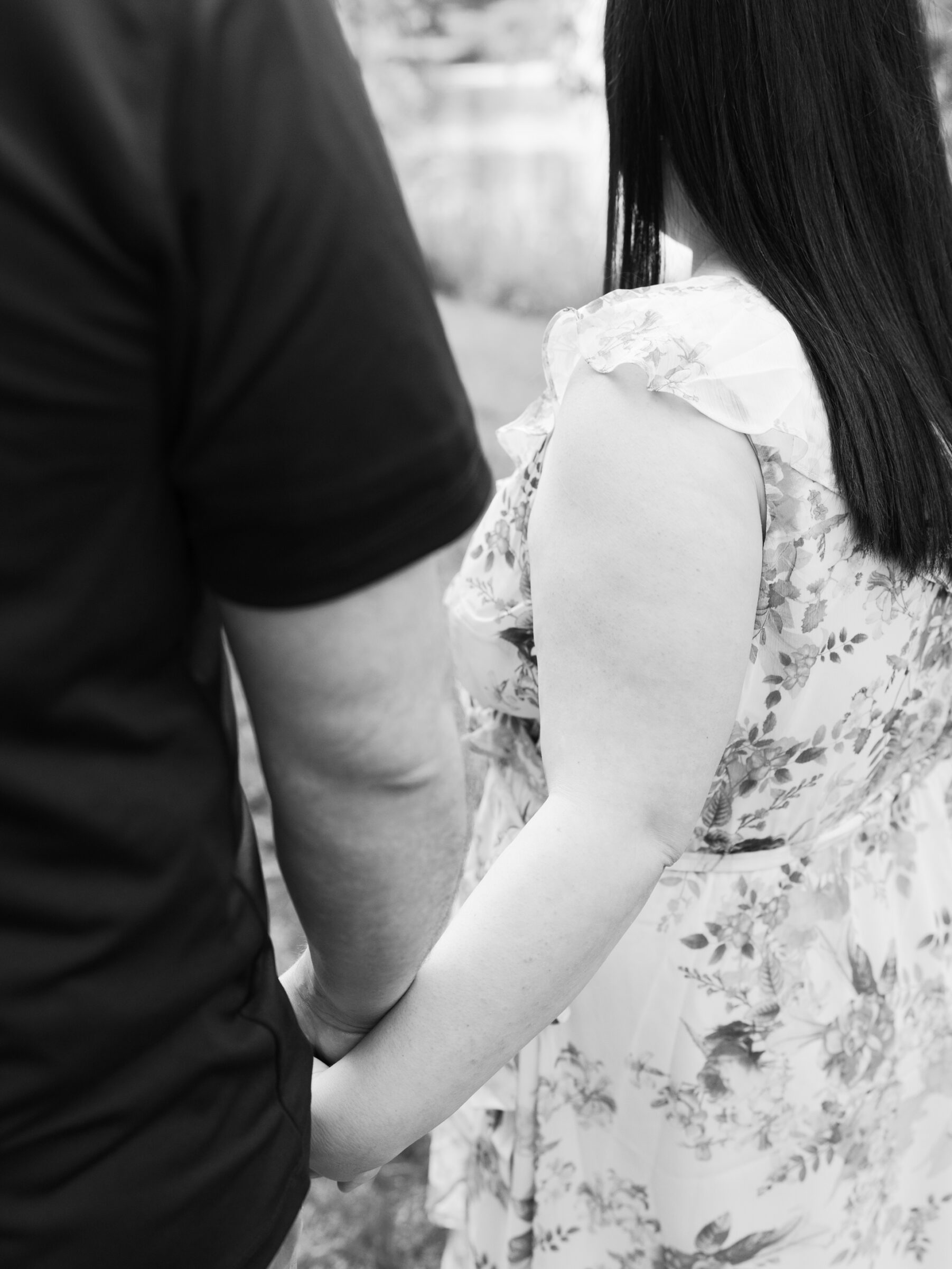 Meadowlark Botanical Gardens Engagement Session | black and white closeup of couple holding hands