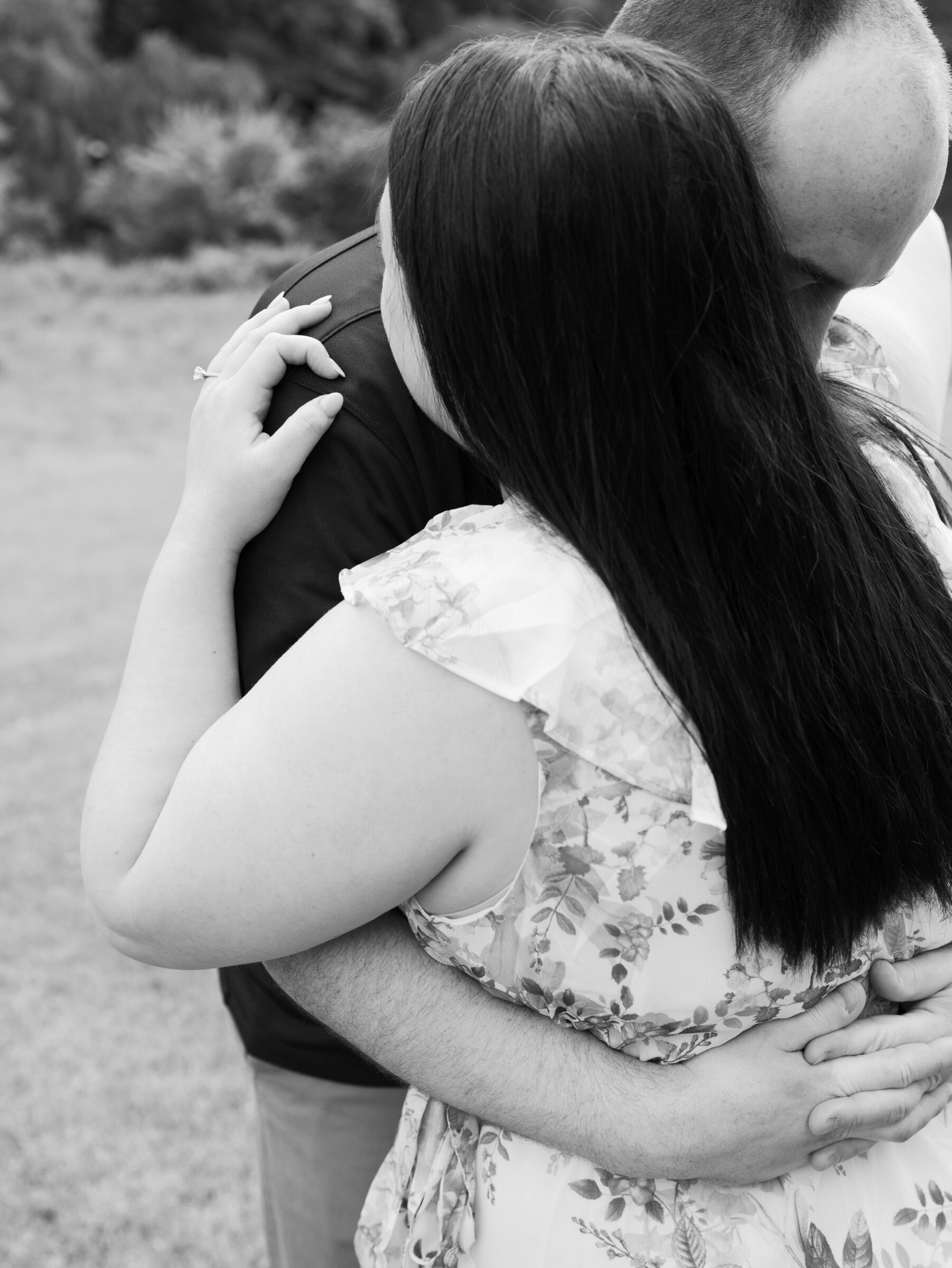 Meadowlark Botanical Gardens Engagement Session | black and white closeup image of a couple hugging