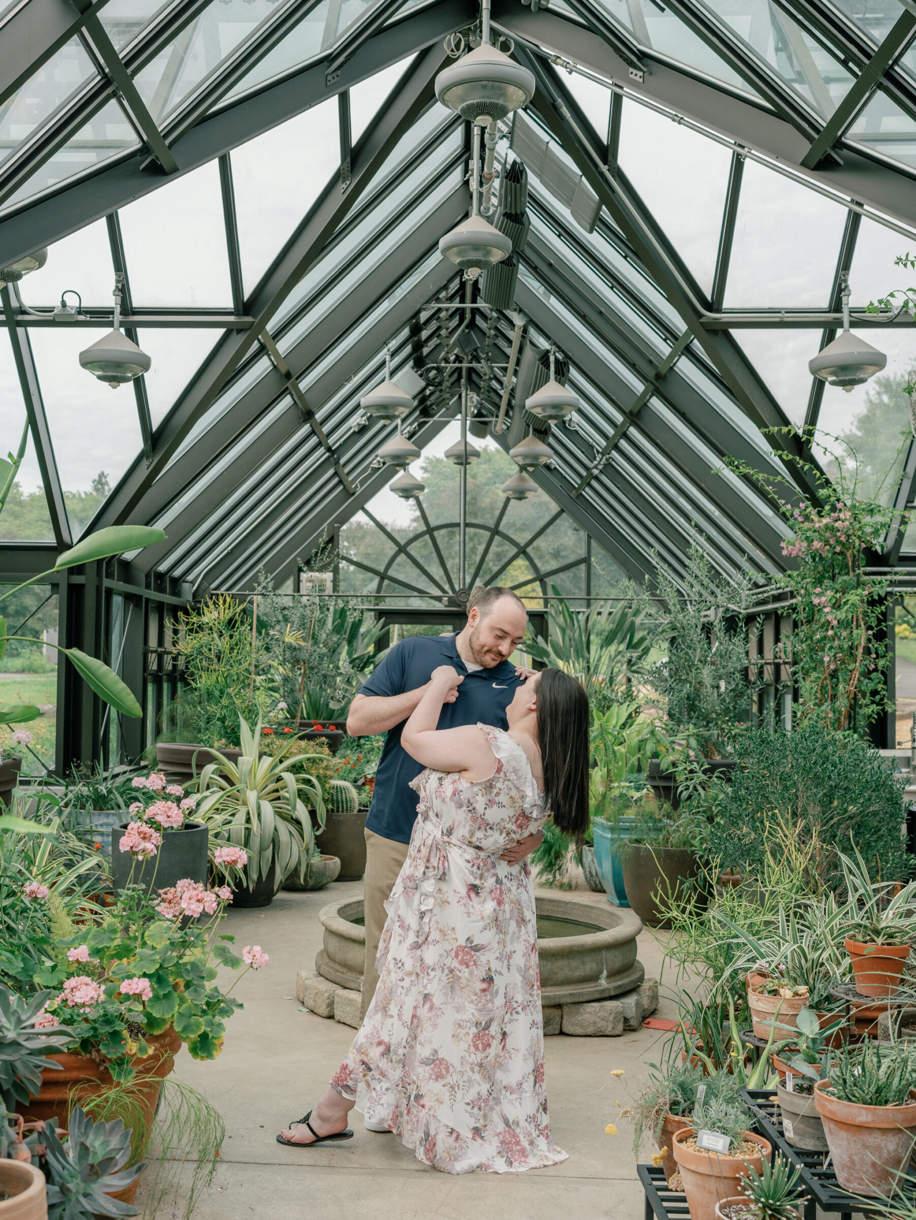 Meadowlark Botanical Gardens Engagement Photos | groom-to-be dips his bride-to-be in the Meadowlark Botanical Gardens greenhouse in Northern VA