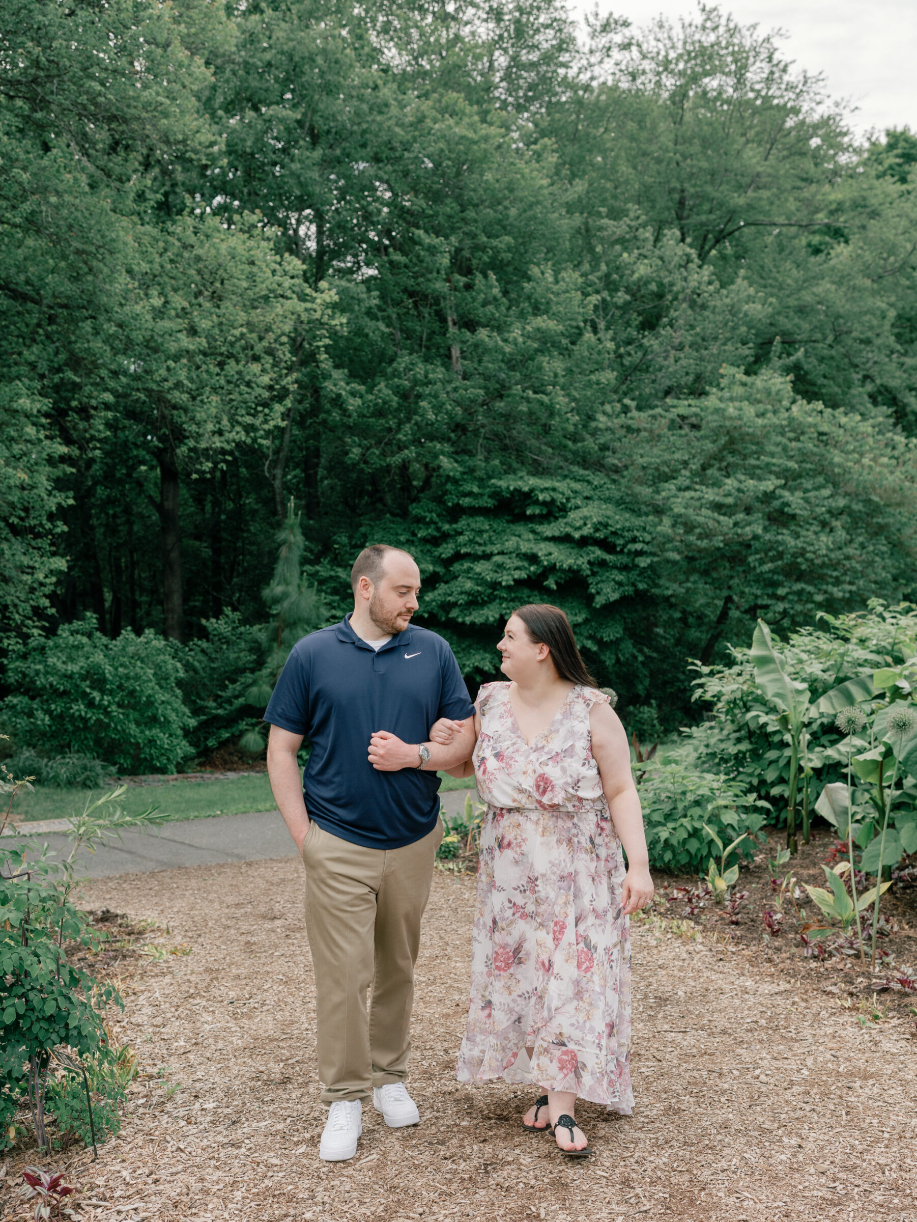 Meadowlark Botanical Gardens Engagement Session | couple walks arm-in-arm on a path at Meadowlark Botanical Gardens in Northern VA
