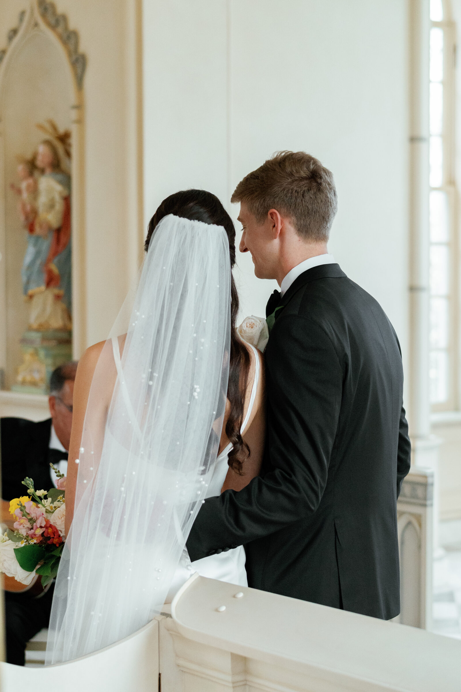 Trump Winery Grand Hall in Charlottesville, VA | bride and groom nuzzle together during worship