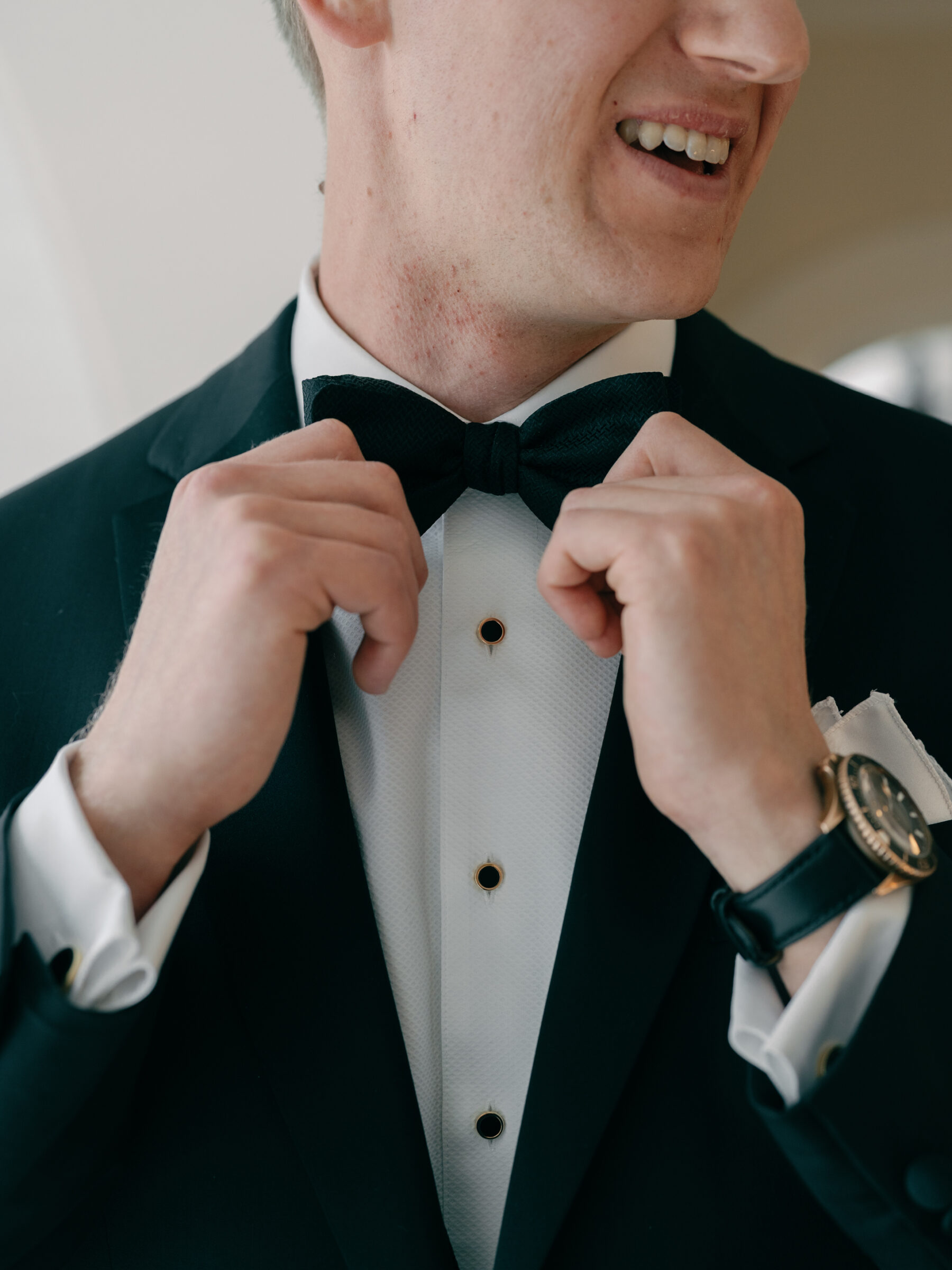 Charlottesville VA Wedding Photographer | groom at Trump Winery adjusts bow tie