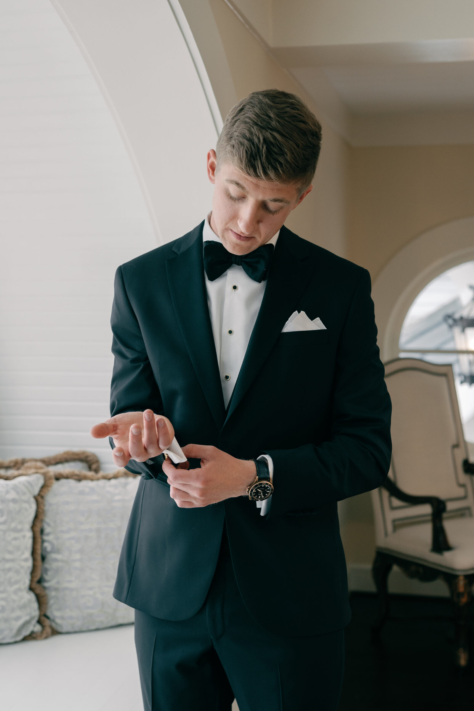 Charlottesville VA Wedding Photographer | groom adjusts cuff links