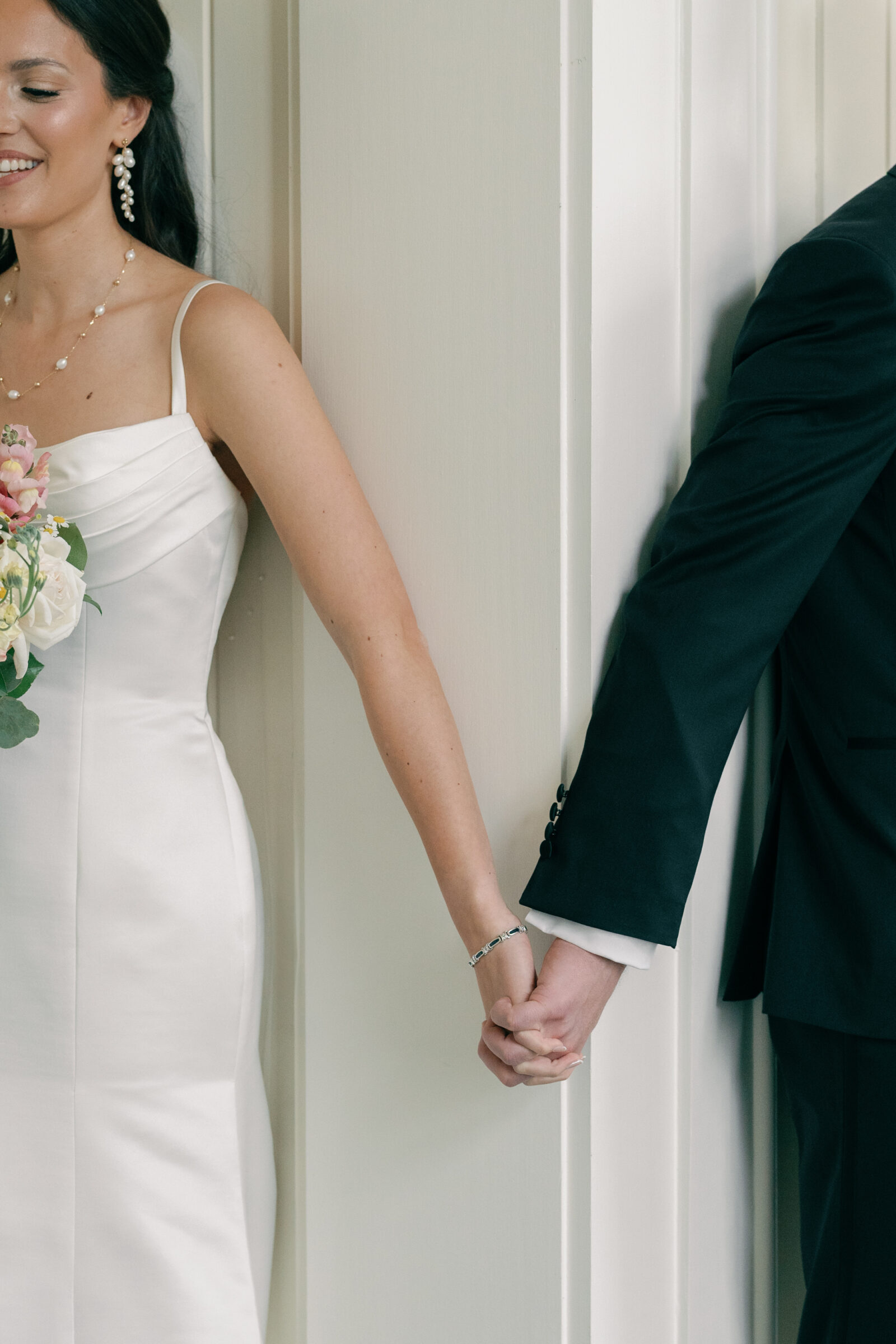Charlottesville VA Wedding Photographer | closeup of hands while couple shares a first touch