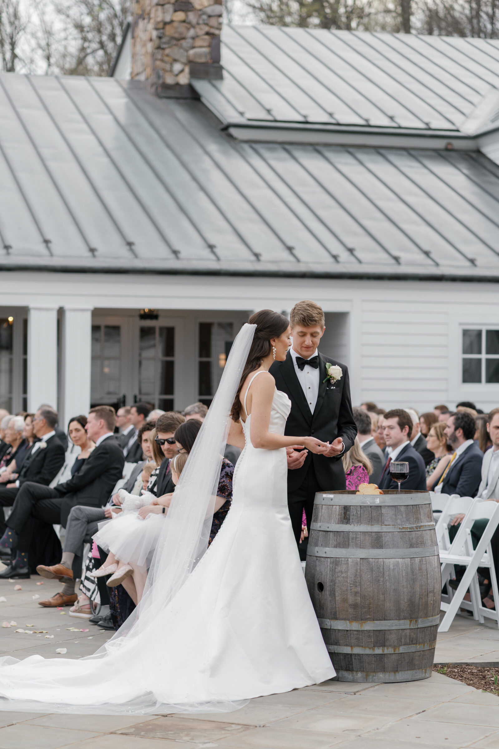 Wedding at Trump Winery Grand Hall | couple praying over communion during wedding ceremony