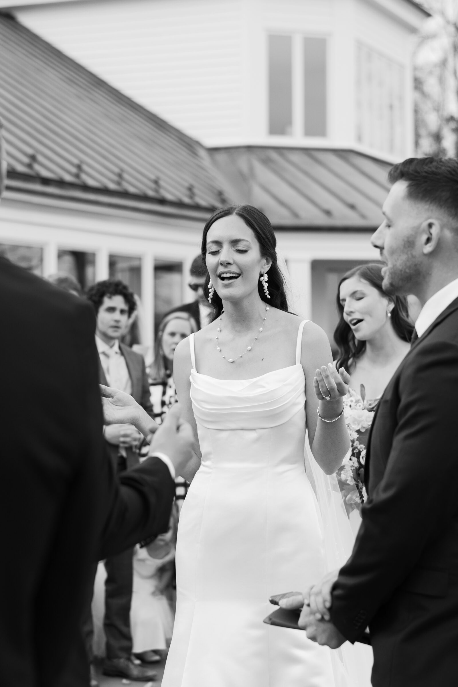 Wedding at Trump Winery Grand Hall | bride worshipping during ceremony song