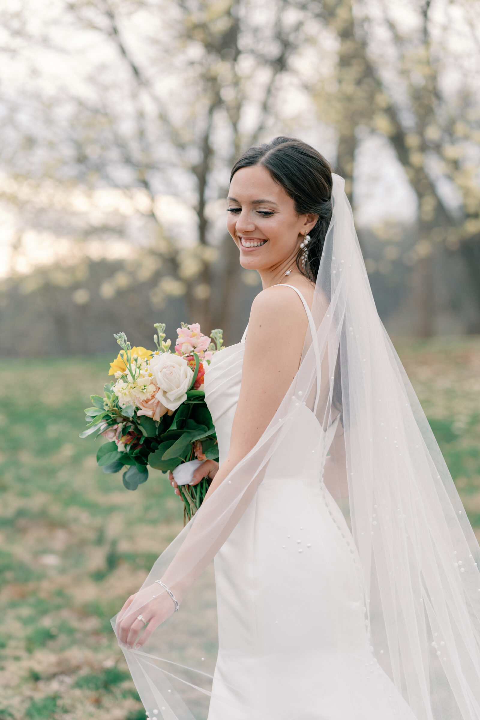 Wedding at Trump Winery in Charlottesville VA | bride plays with her veil