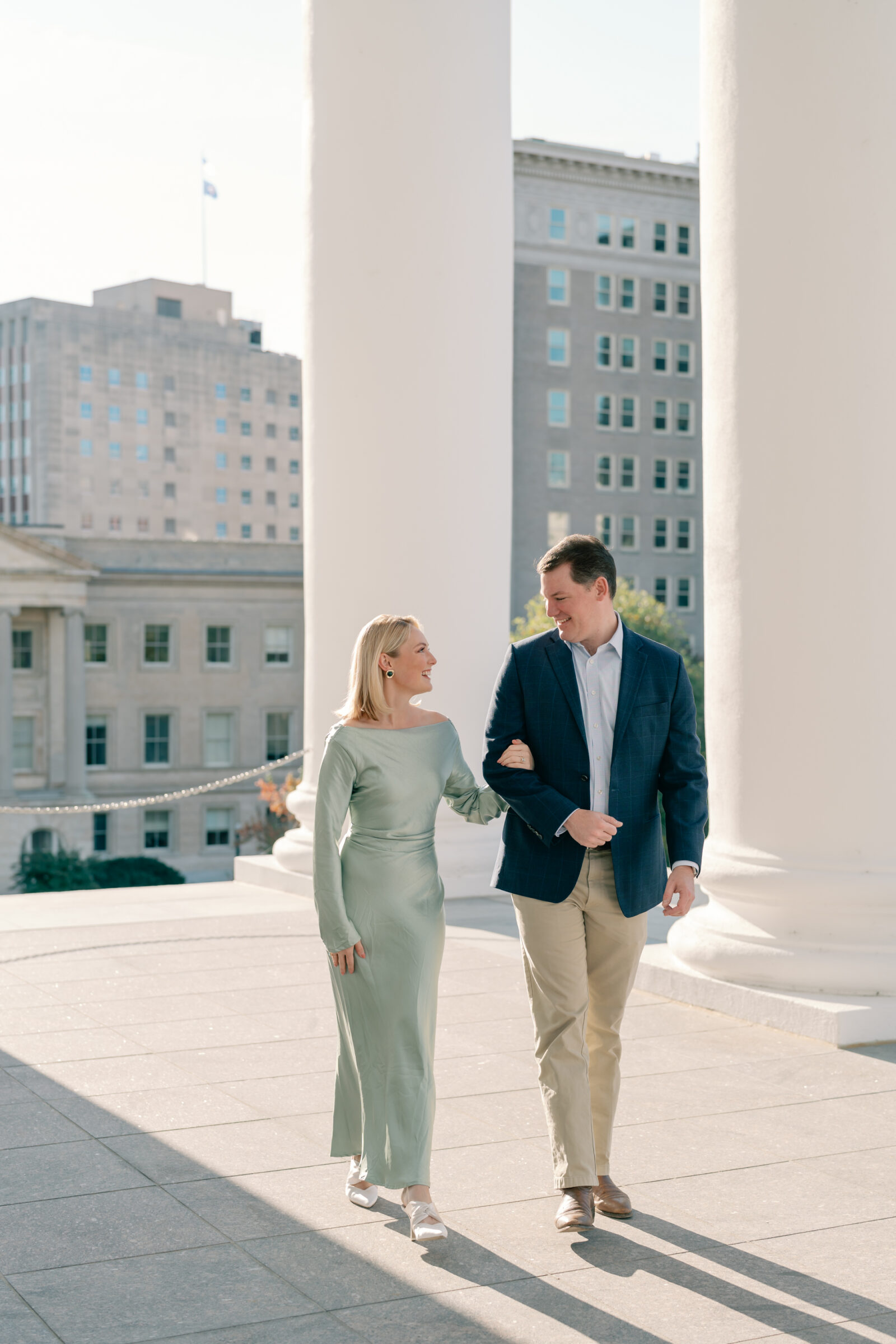 Richmond Engagement Session | couple walks arm in arm at the Virginia Capitol Building in Richmond