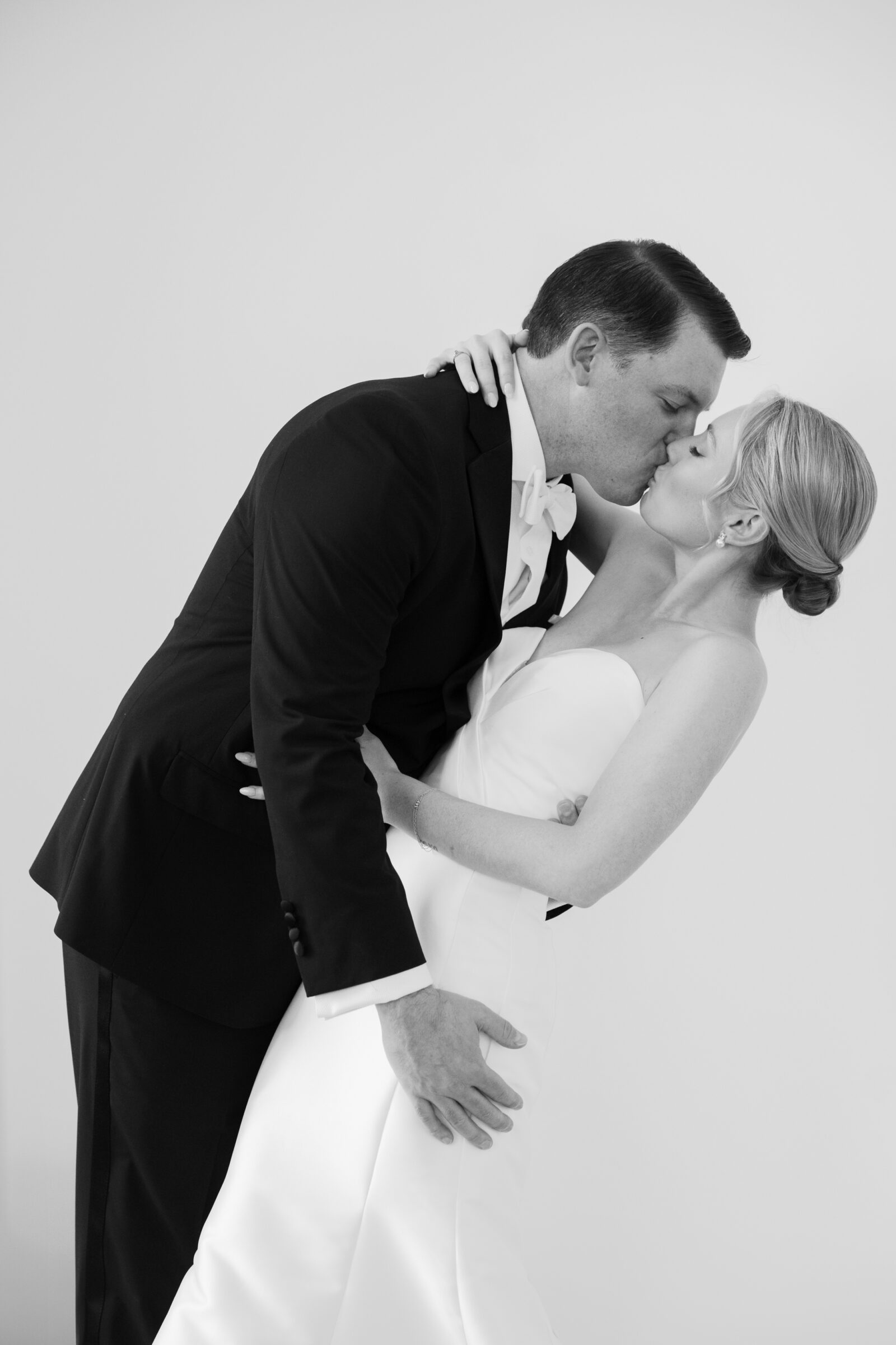 Black and white photo of a groom dipping his bride for a kiss inside Northfield Estate in Cumberland, VA—an elegant and timeless wedding portrait captured near Richmond, Virginia.