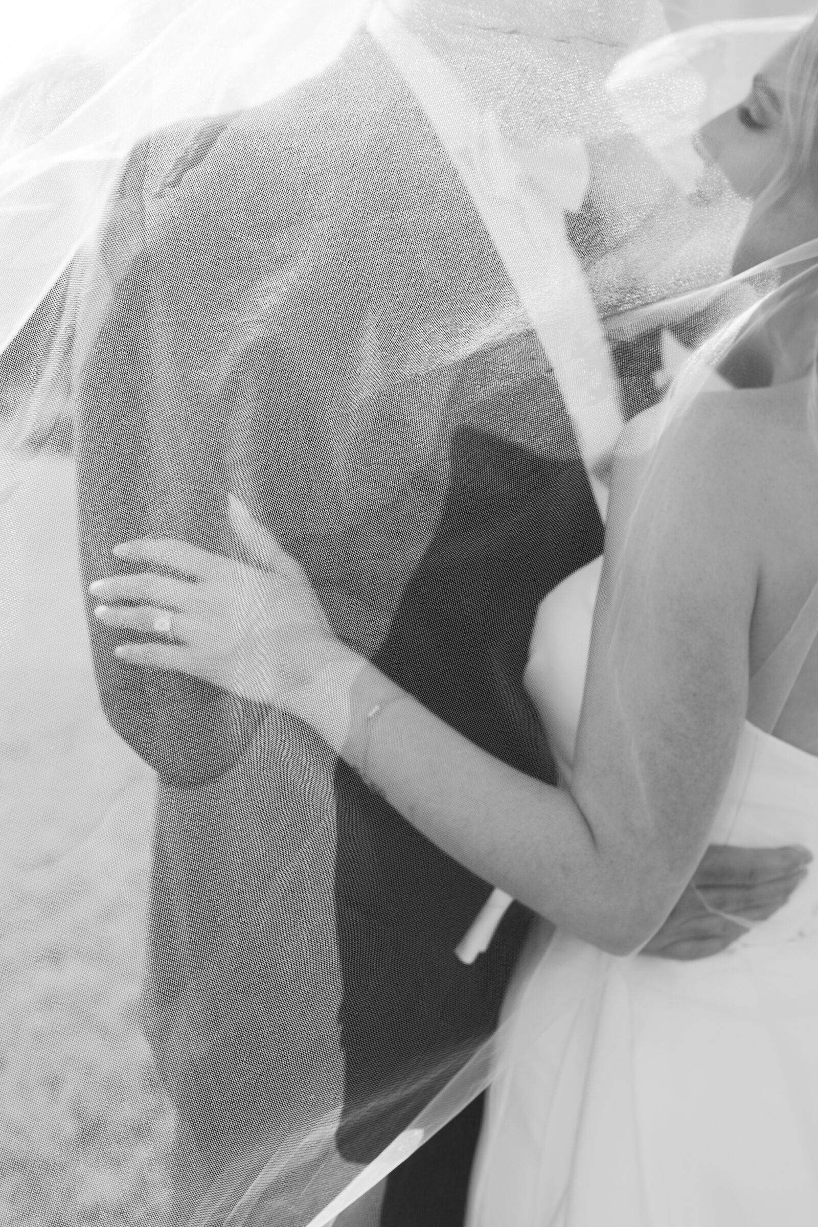 Artistic black and white portrait of a bride and groom under a flowing veil at Northfield Estate in Cumberland, VA—capturing an intimate and timeless wedding moment near Richmond.