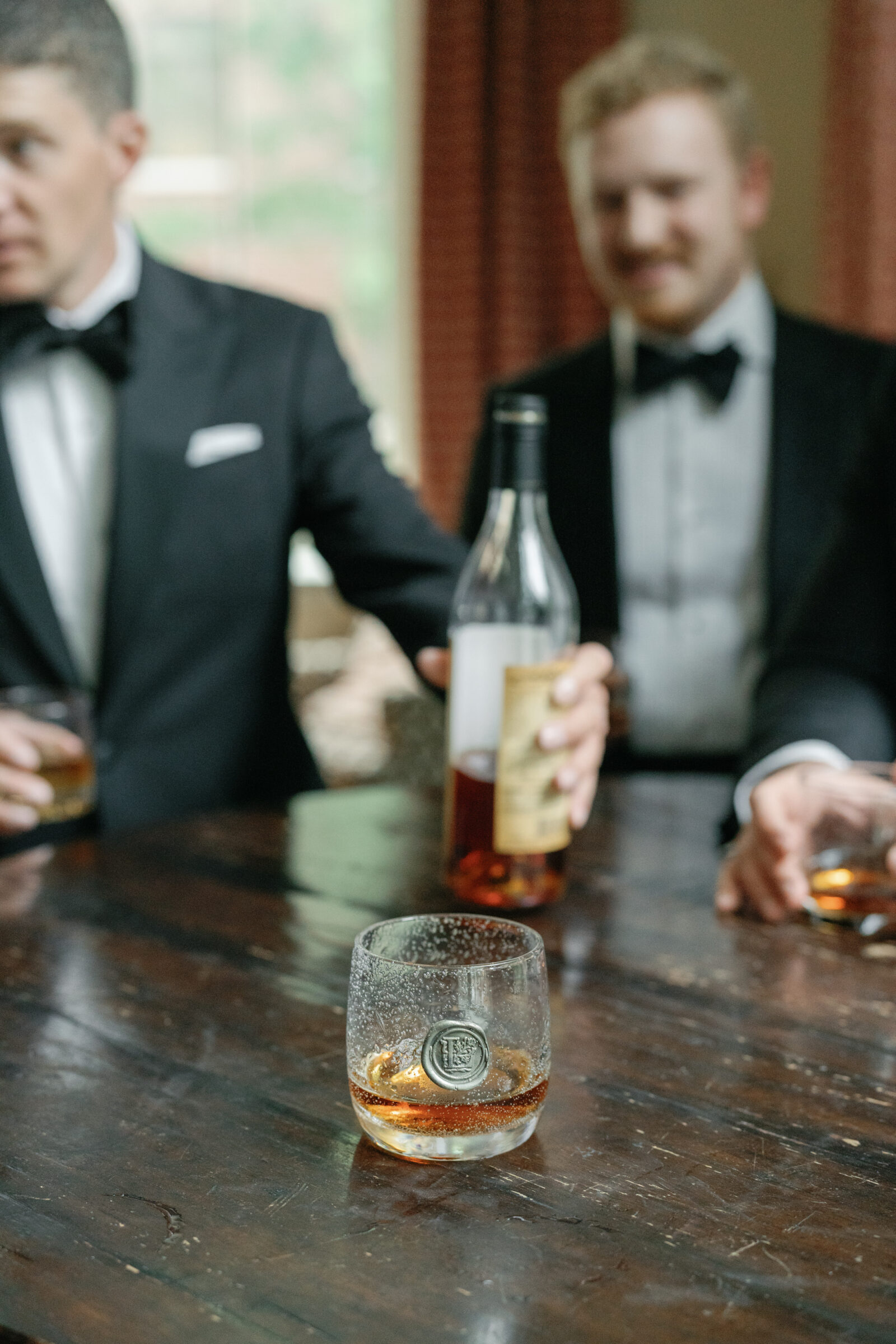 Groomsmen sharing bourbon together before a wedding in Richmond VA.