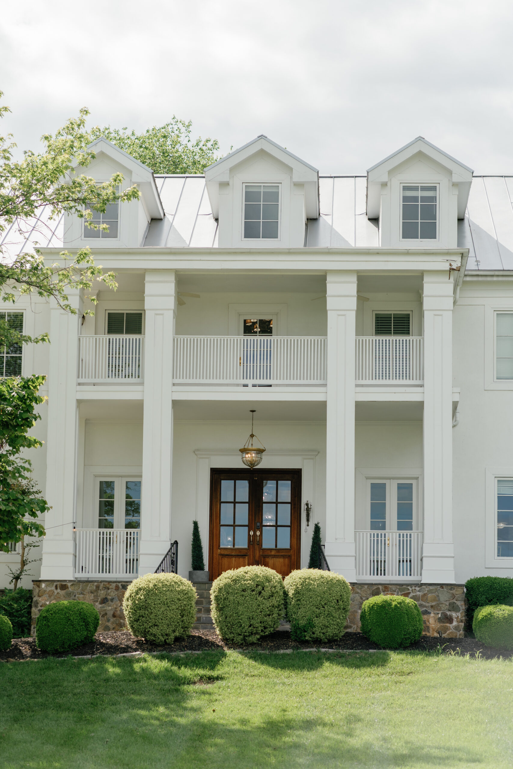 Front entrance of The View at Bluemont, a Northern Virginia wedding venue with classic white columns and elegant architecture.