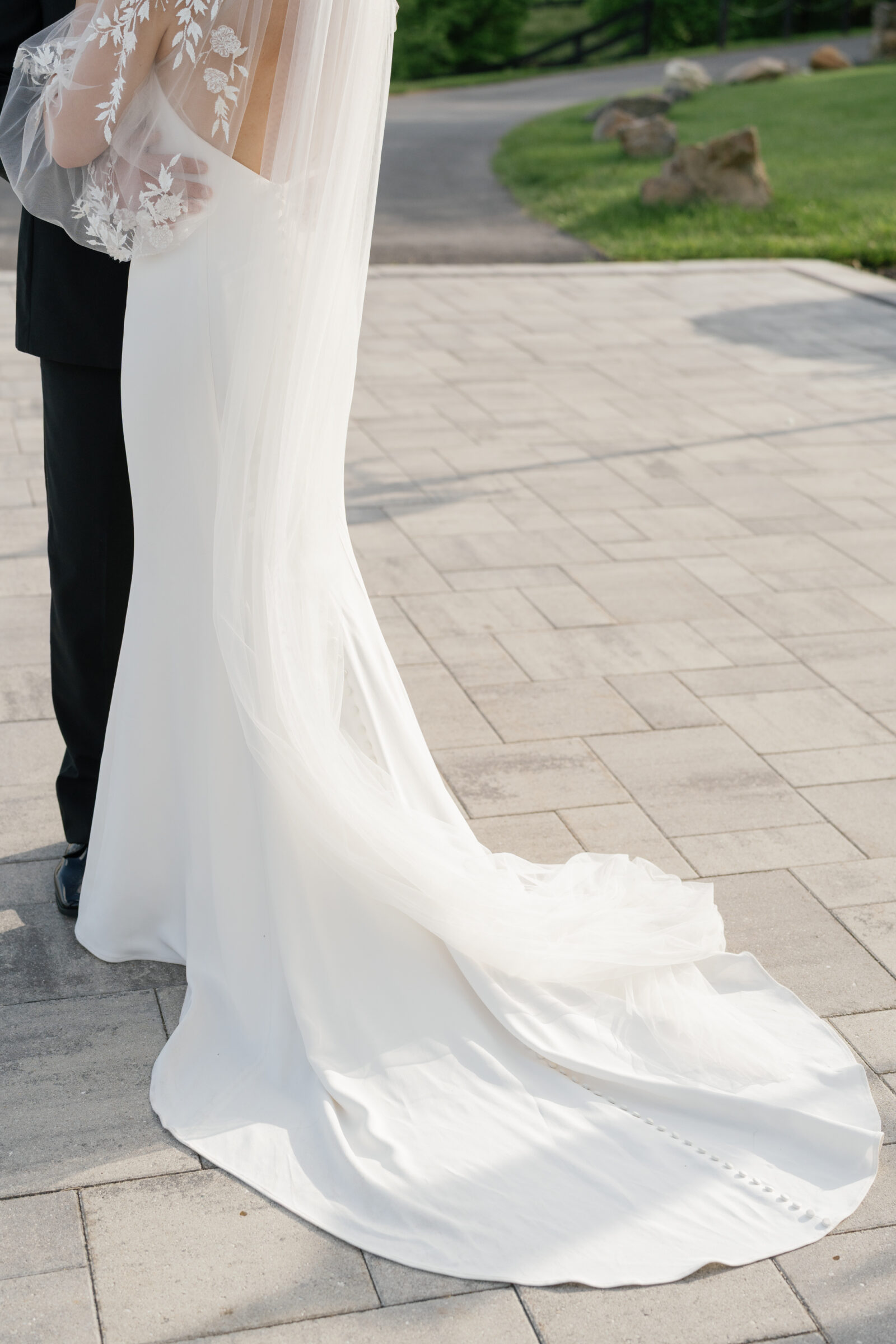 Close-up of bride’s flowing veil and elegant train