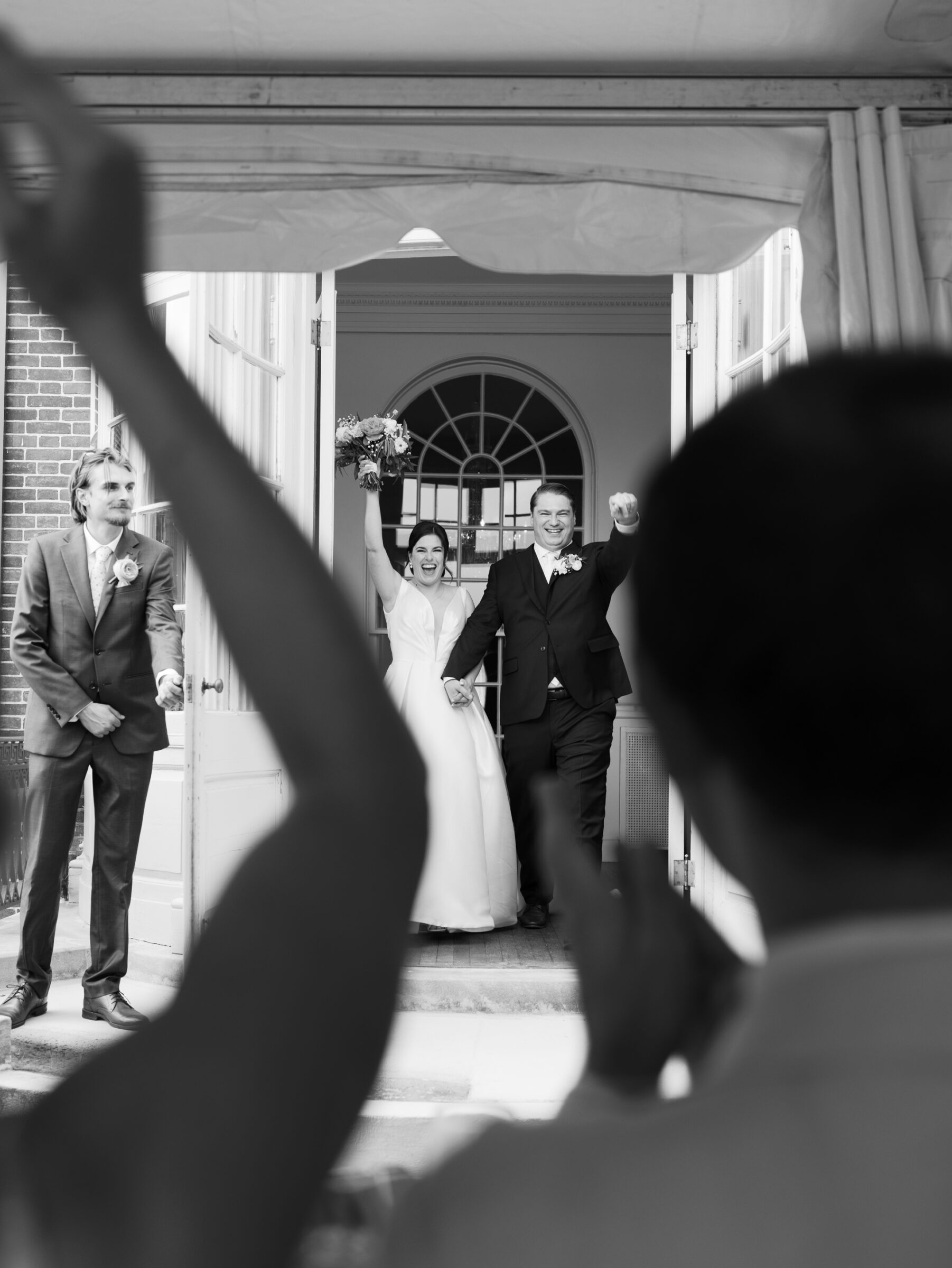 Bride and groom making their grand entrance from the historic house into the tented lawn reception at a Woodrow Wilson House Wedding in Washington DC.