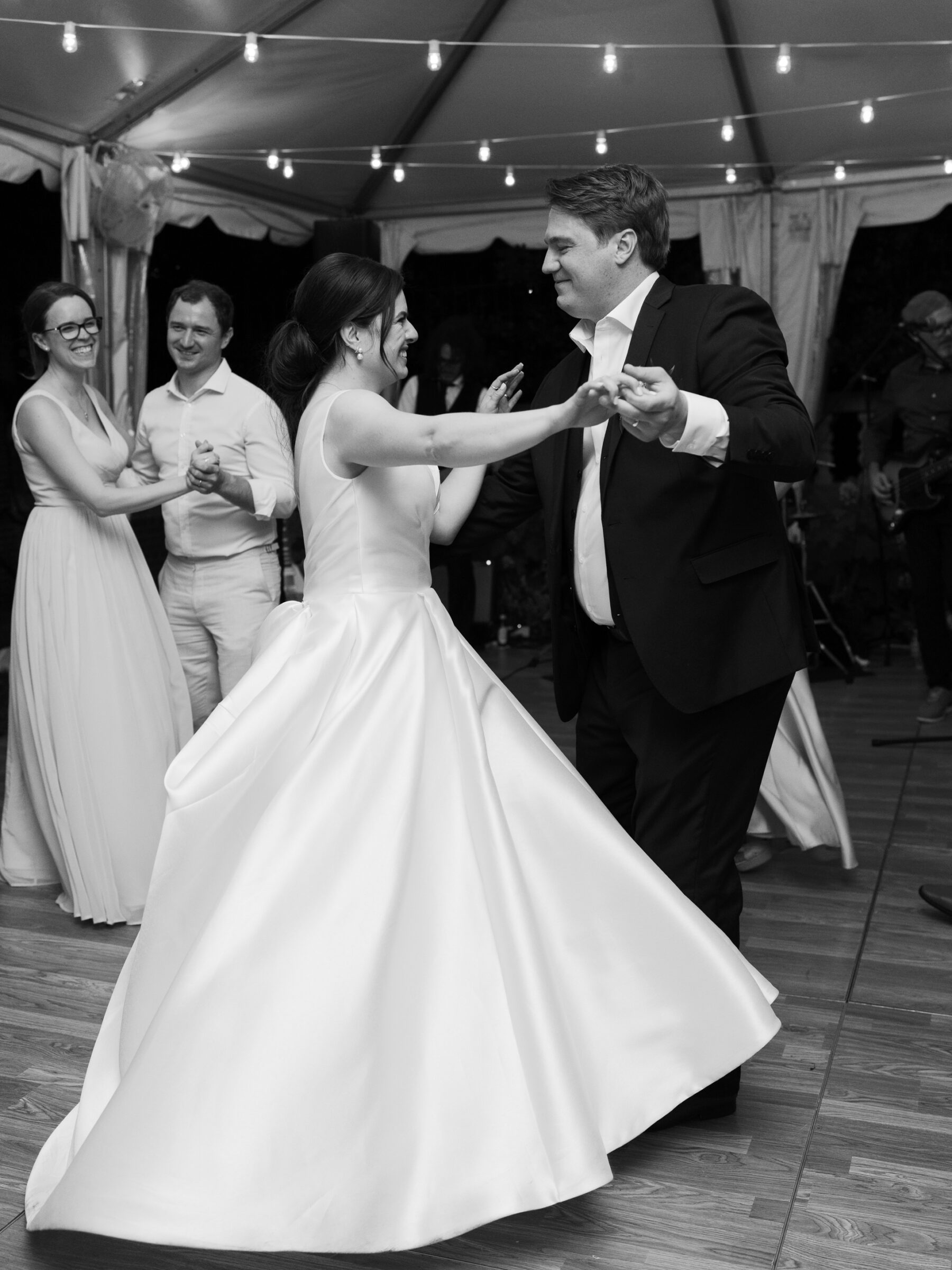 Bride and groom twirling on the dance floor during their wedding reception at Woodrow Wilson House in Georgetown DC.