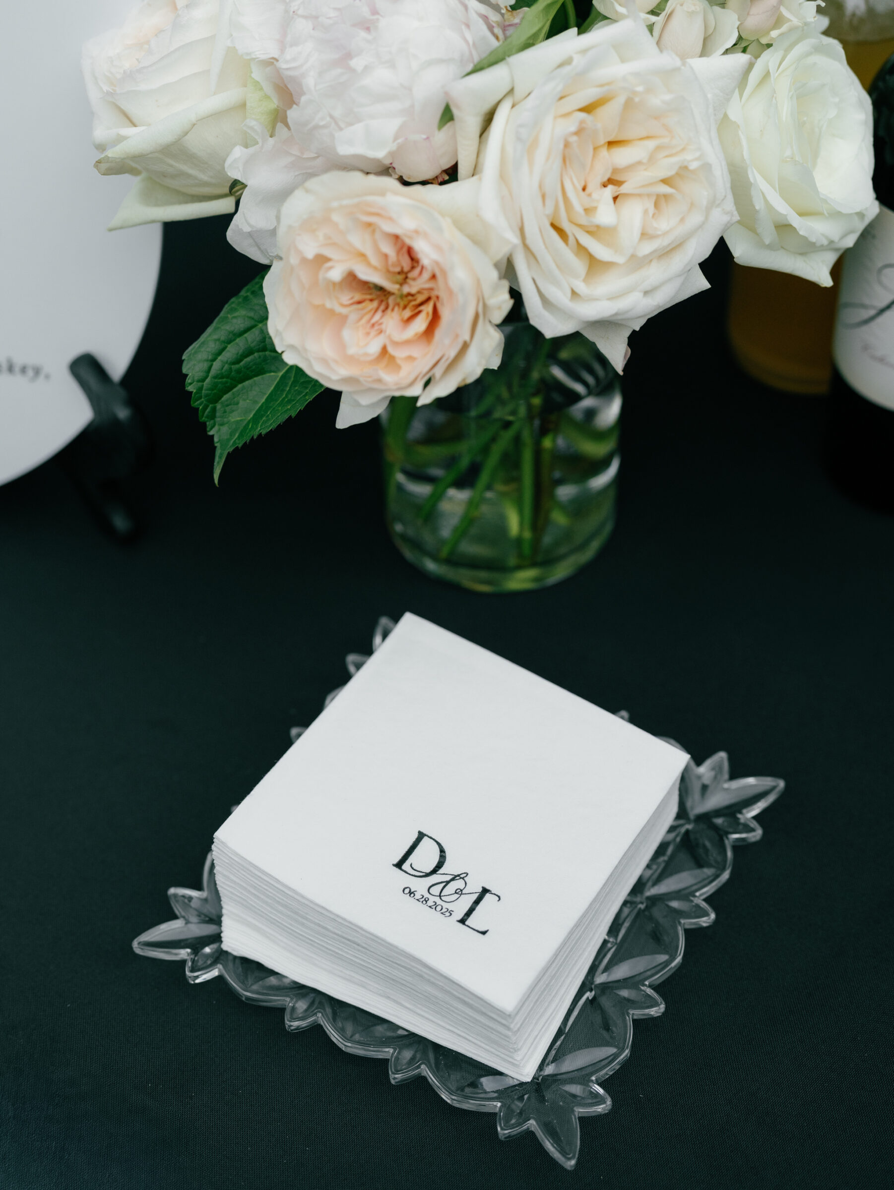 Personalized cocktail napkins paired with elegant florals during a timeless The View at Bluemont Wedding in Northern Virginia.