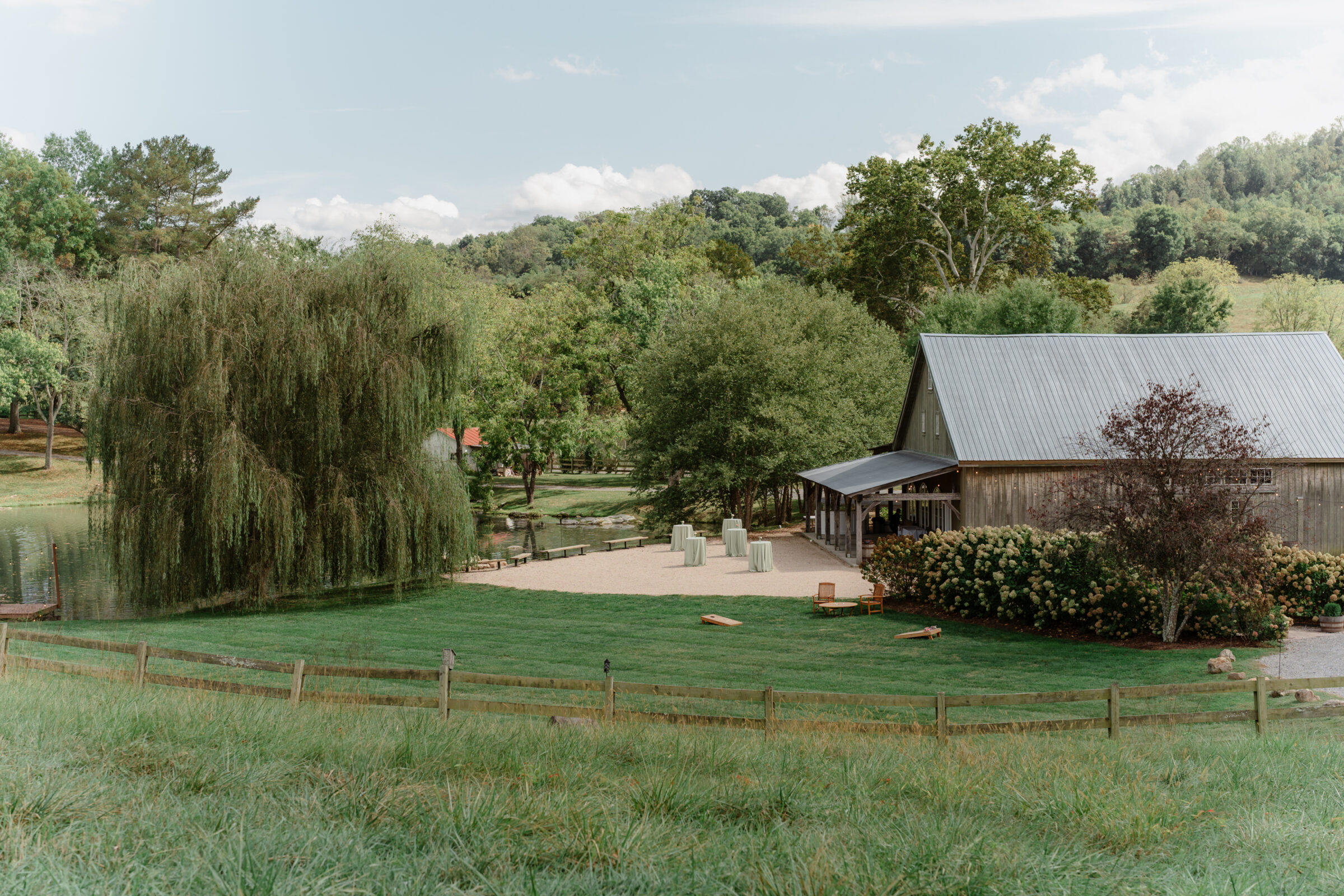 Big Spring Farm wedding venue in Lexington, VA with barn reception space, pond, and mountain views