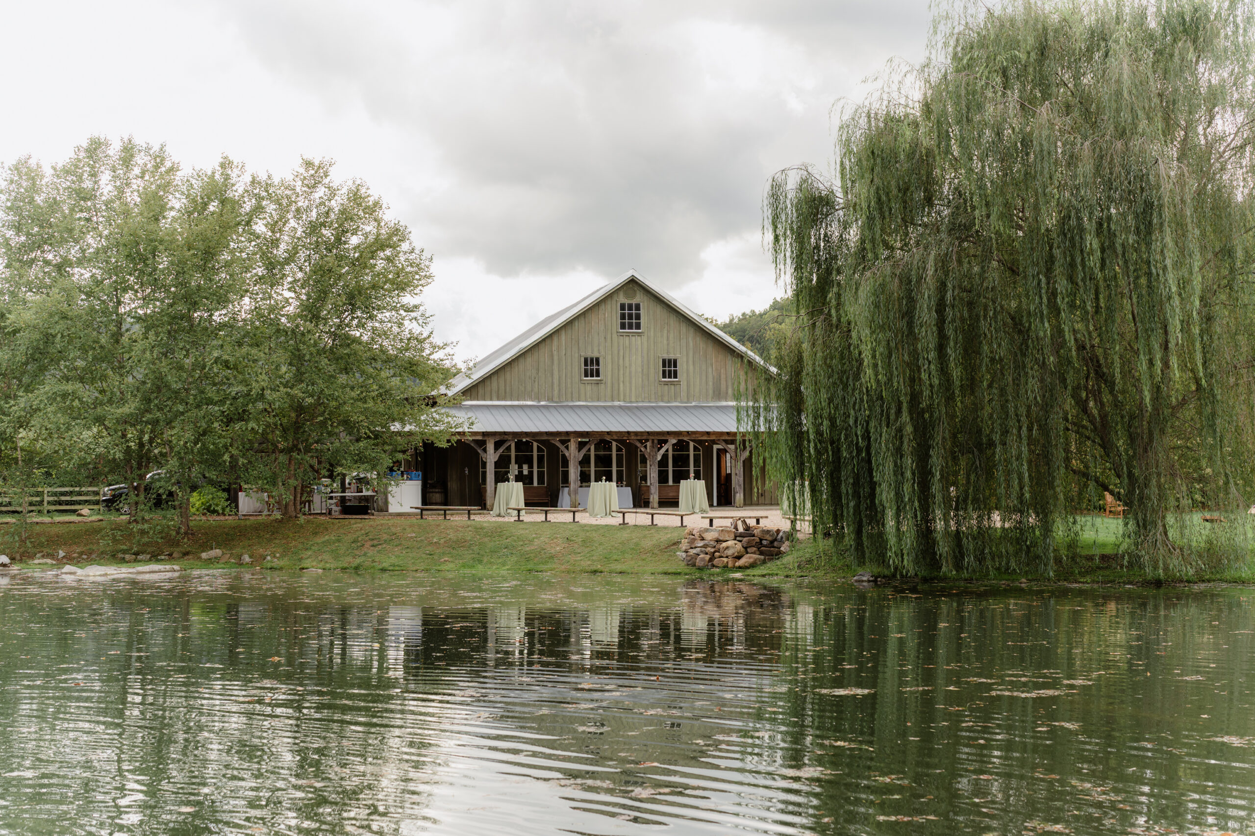 Barn reception space at Big Spring Farm wedding venue in Lexington, VA overlooking the pond