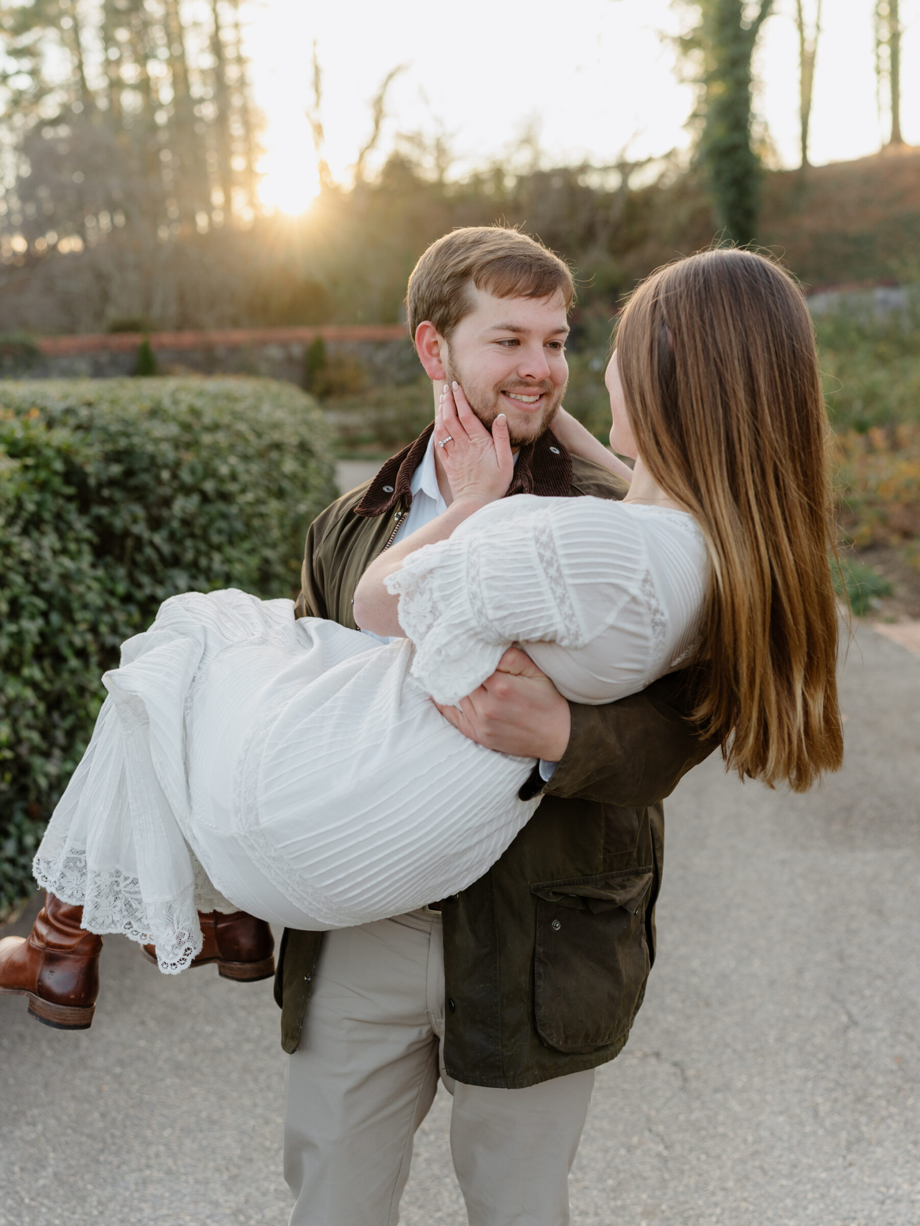 Romantic engagement portrait of a couple sharing a quiet moment at sunset
