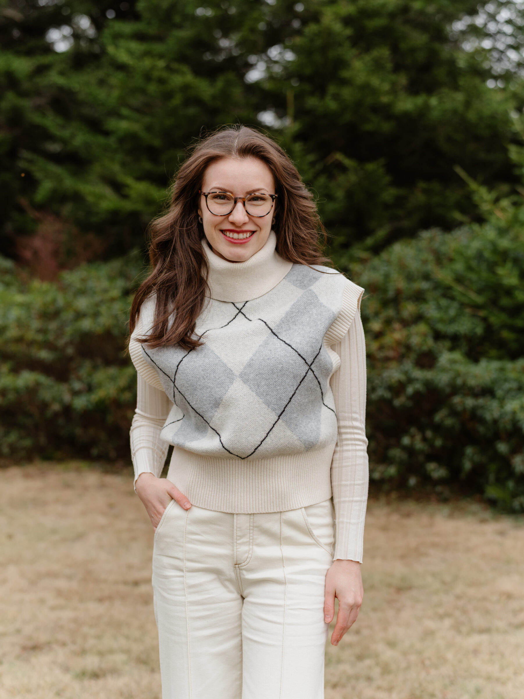 Young adult family member wearing winter layers during a late fall family photo session at Grayson Highlands State Park in Southwest Virginia