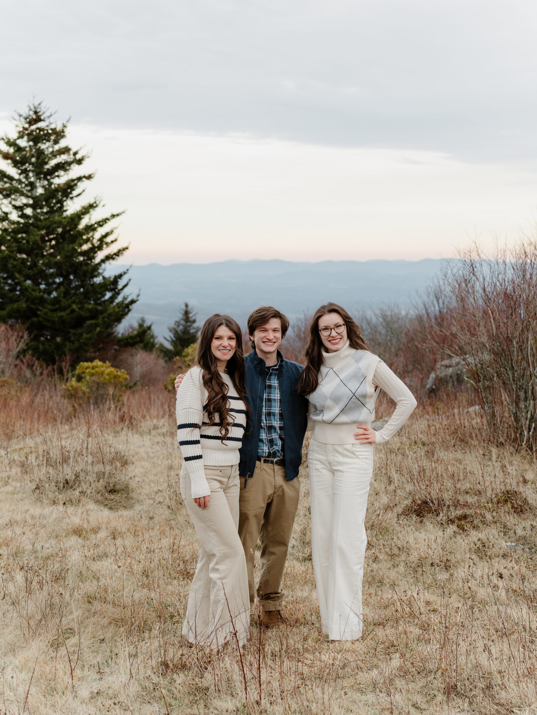 Adult siblings photographed together during a late fall family session at Grayson Highlands State Park in Southwest Virginia