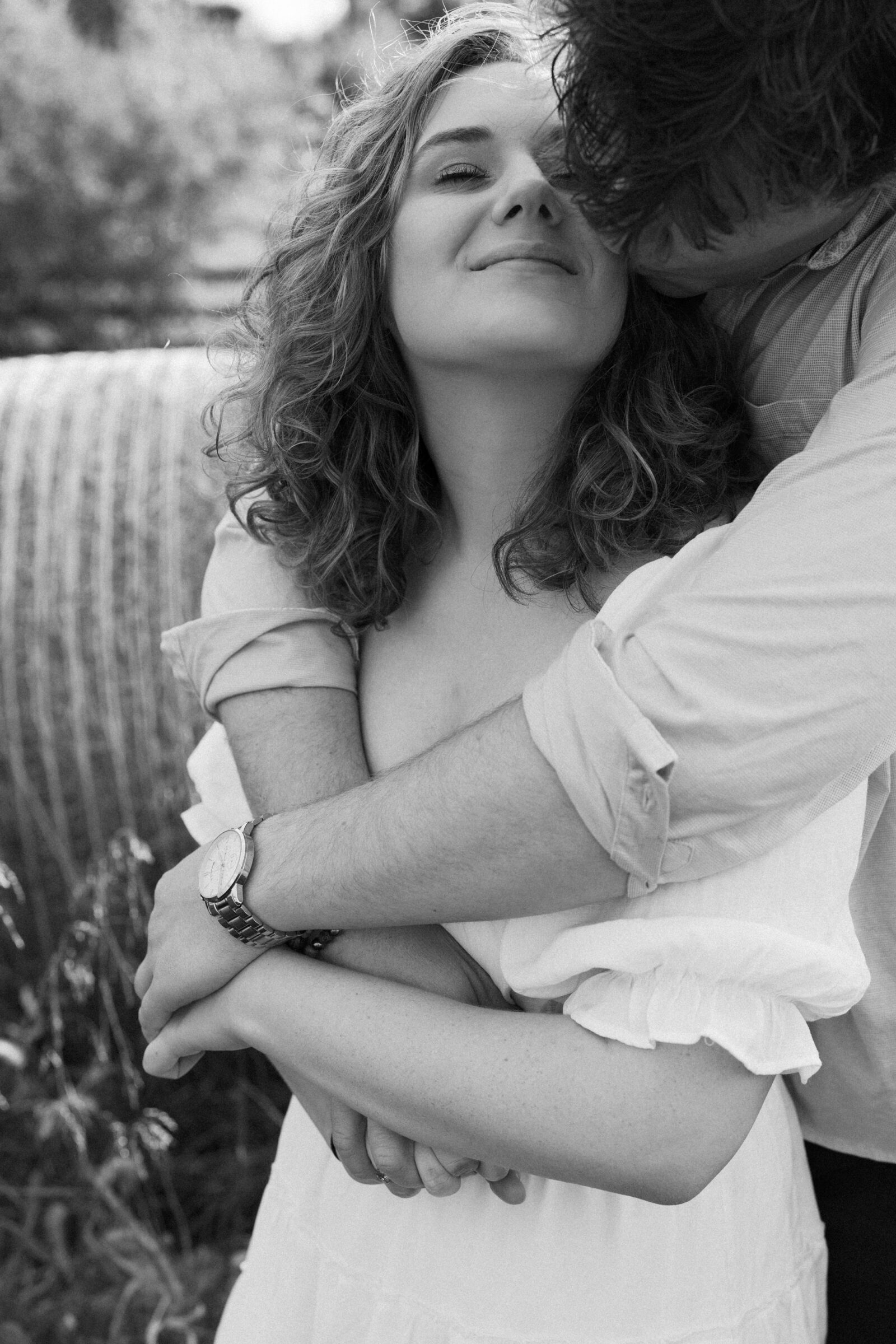 Lovettsville VA Wedding Photographer | Black and white engagement portrait of a couple embracing during an intimate at-home session in Lovettsville, Virginia