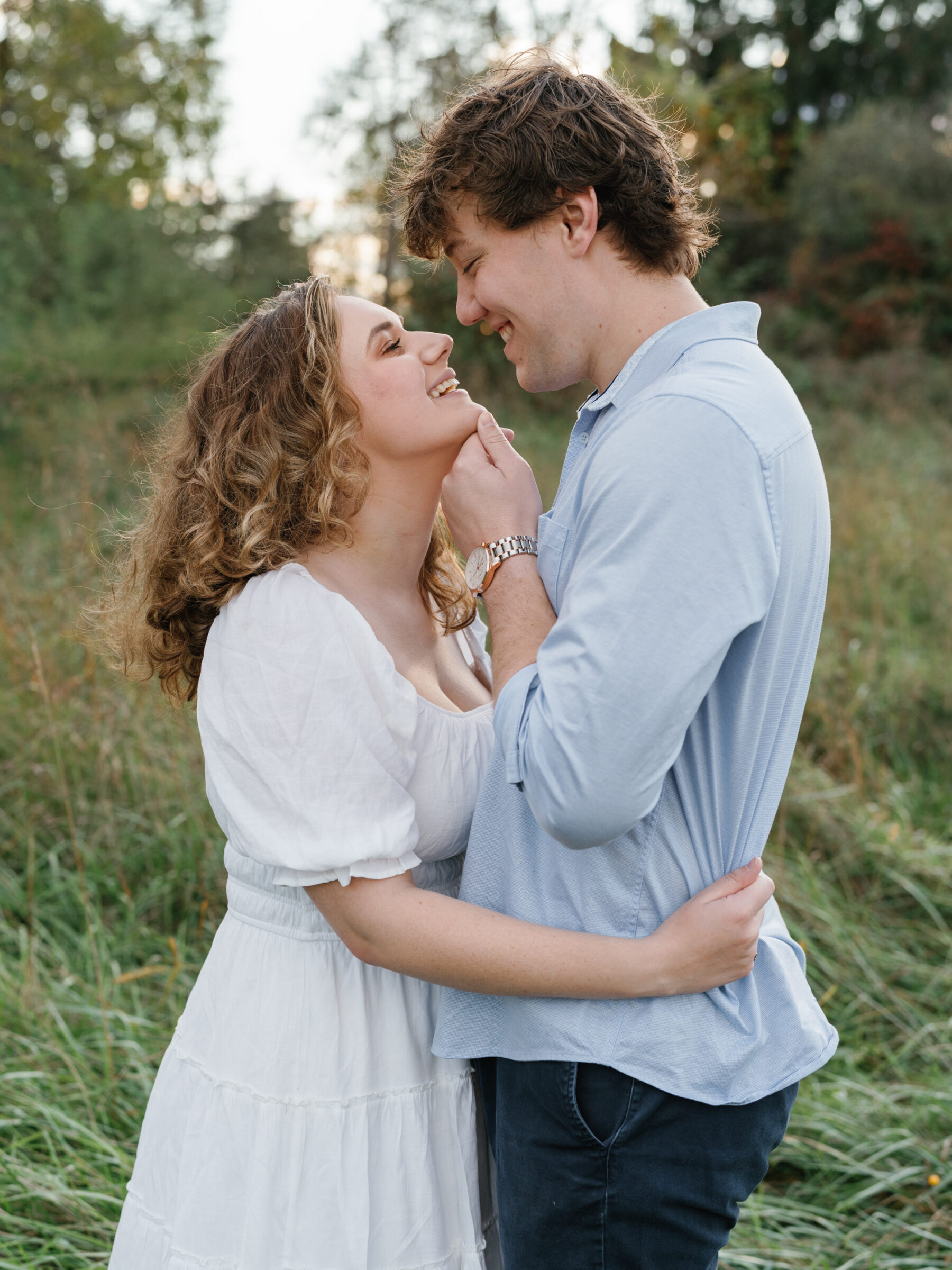 Engaged couple sharing a close, candid moment during an at-home engagement session in Lovettsville, Virginia