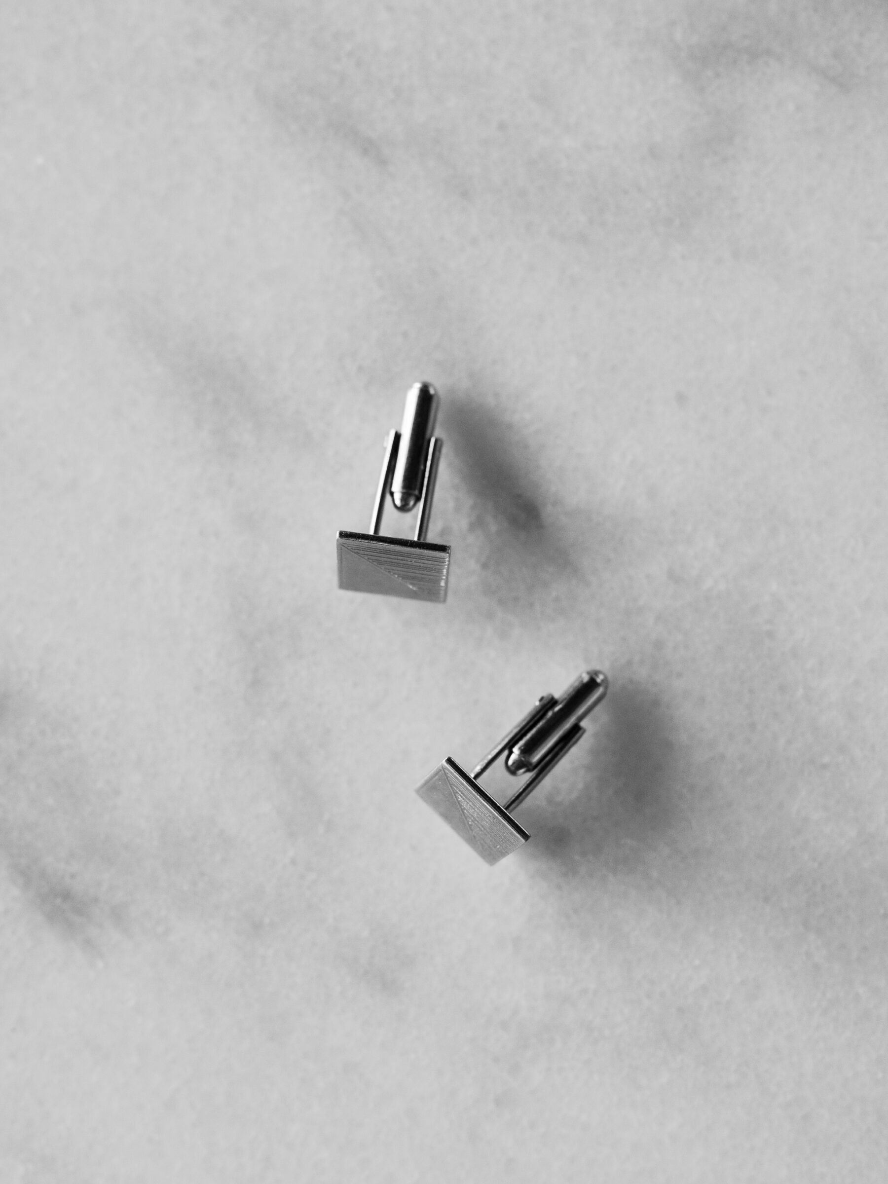 Groom’s silver cufflinks photographed