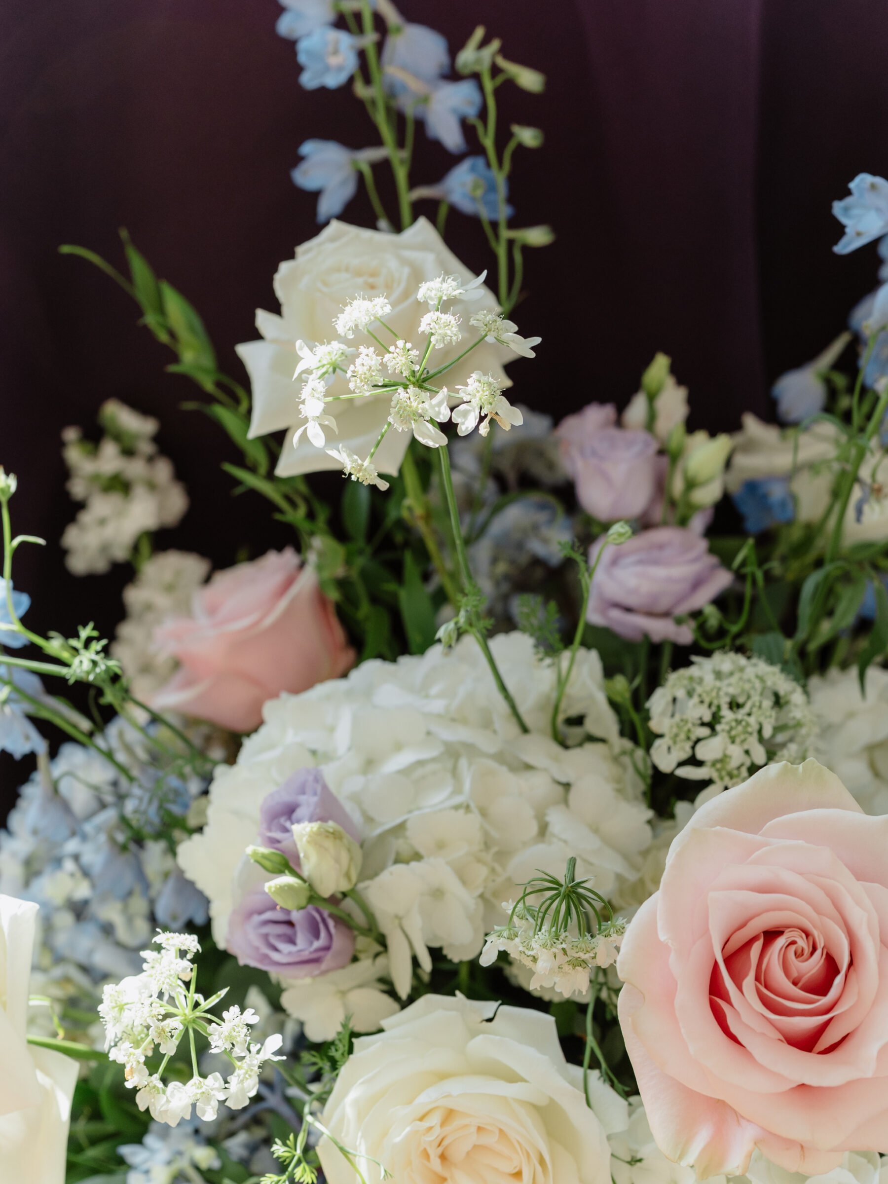 Pastel wedding floral arrangement with blush roses and soft lavender blooms at a scenic Bluemont VA wedding