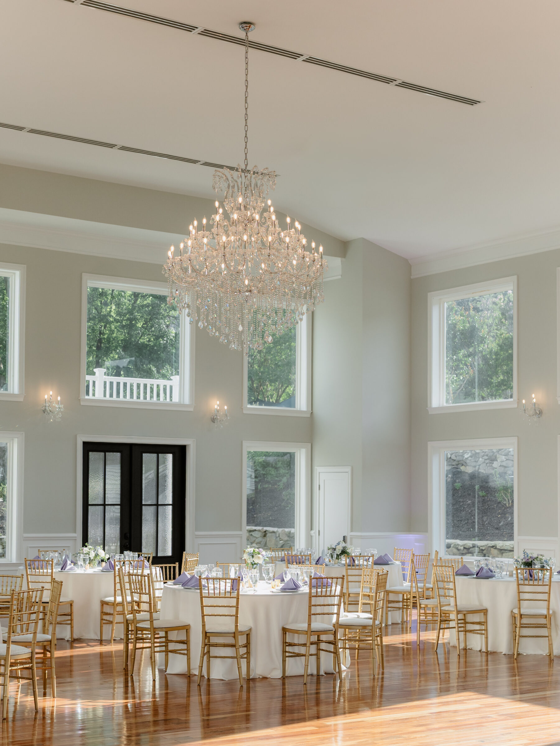 Elegant ballroom reception with crystal chandeliers during a scenic Bluemont VA wedding